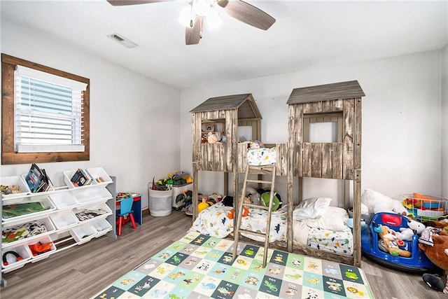 bedroom featuring hardwood / wood-style flooring and ceiling fan