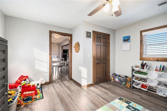 game room featuring light hardwood / wood-style flooring and ceiling fan