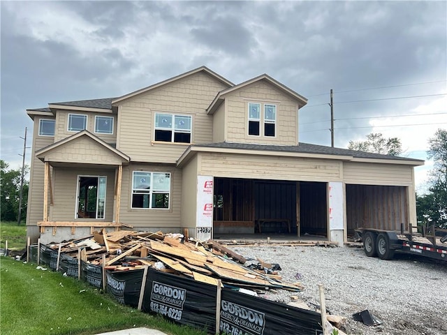 19033 W 169th Pl, Olathe, KS 66062 - view of front of house with gravel driveway and an attached garage