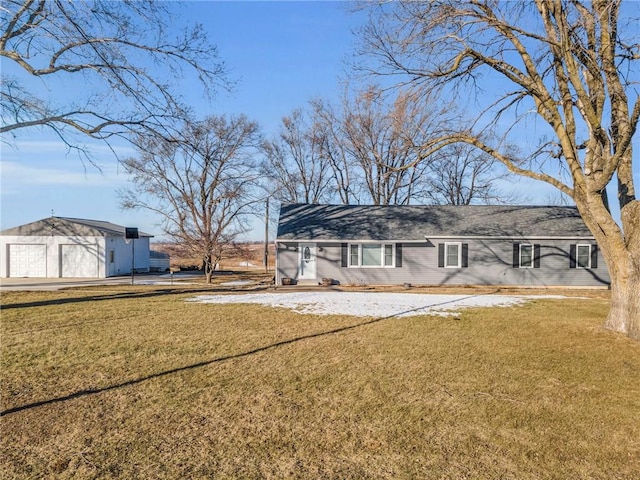 rear view of house with a yard