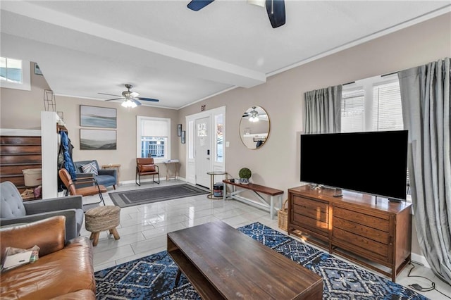 living room featuring light tile patterned floors, crown molding, beamed ceiling, and ceiling fan