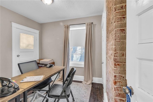 office space featuring hardwood / wood-style floors and a textured ceiling