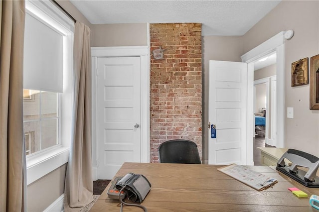 home office featuring a textured ceiling