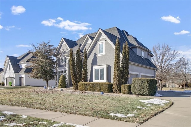 view of front facade with a garage and a front yard