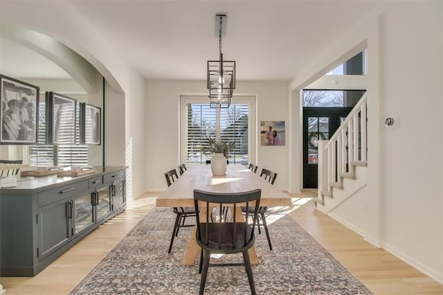 dining space with light hardwood / wood-style flooring