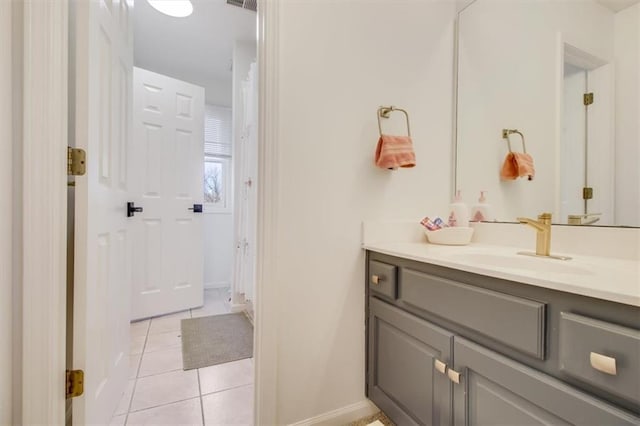 bathroom with tile patterned floors and vanity