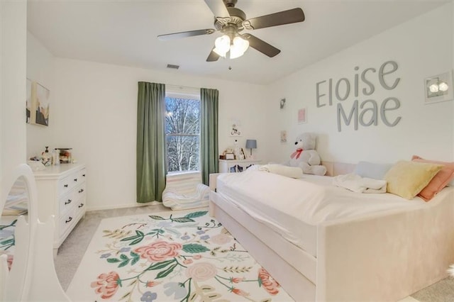 carpeted bedroom with ceiling fan