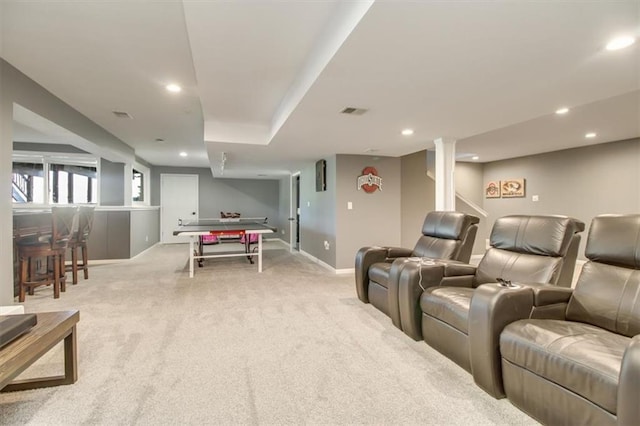 home theater featuring light carpet