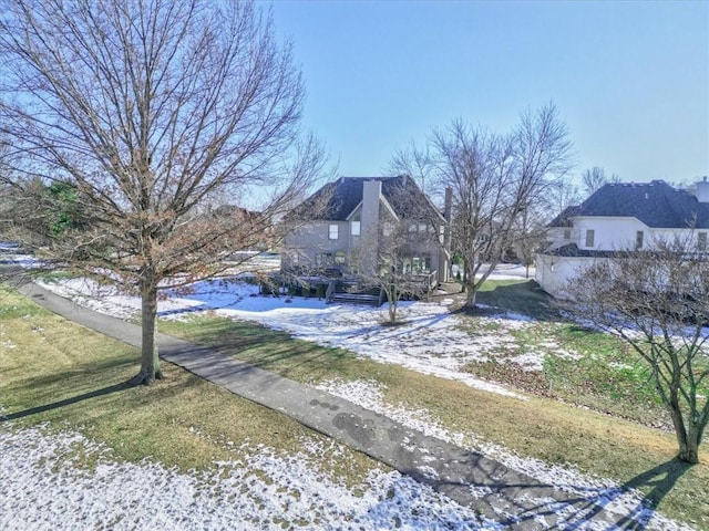 view of yard layered in snow