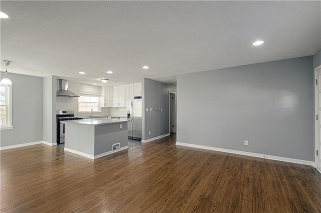 unfurnished living room with dark wood-type flooring