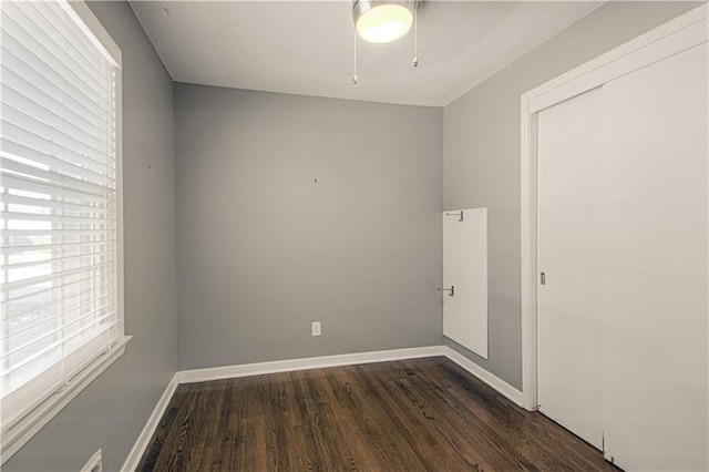 unfurnished room featuring dark hardwood / wood-style floors