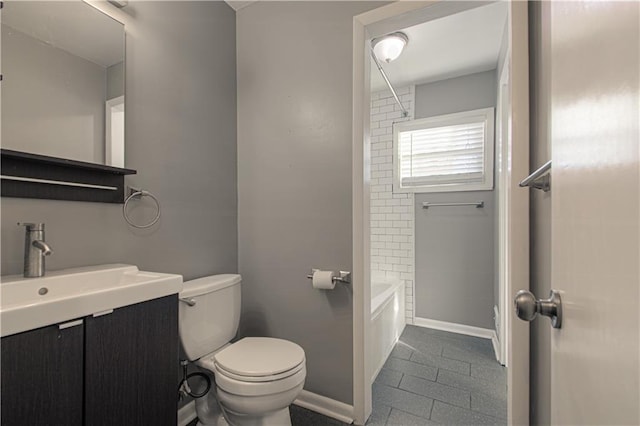 full bathroom with tiled shower / bath combo, vanity, tile patterned floors, and toilet