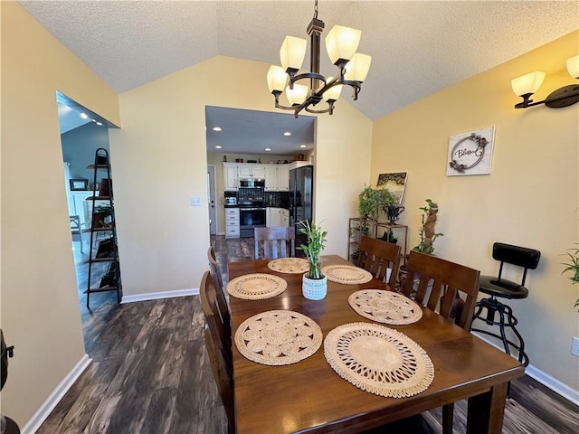 dining space featuring vaulted ceiling, dark hardwood / wood-style floors, a notable chandelier, and a textured ceiling