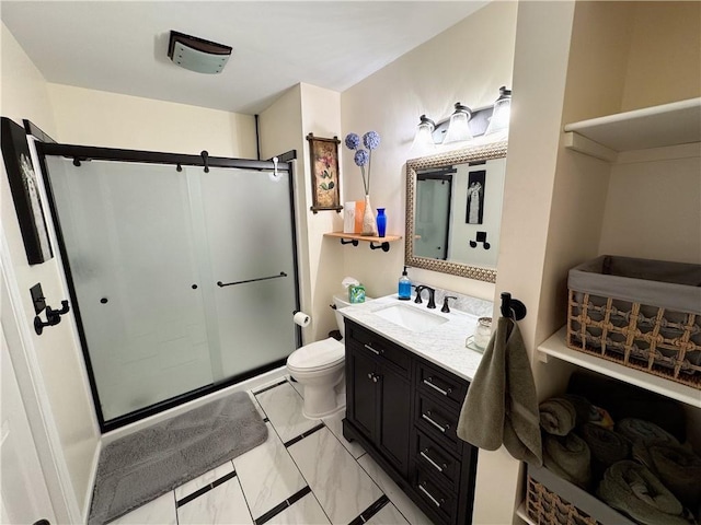 bathroom with vanity, toilet, and walk in shower