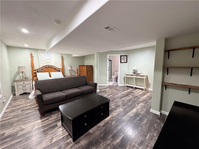 bedroom featuring dark hardwood / wood-style flooring