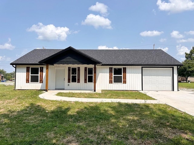 single story home with a garage, covered porch, and a front lawn