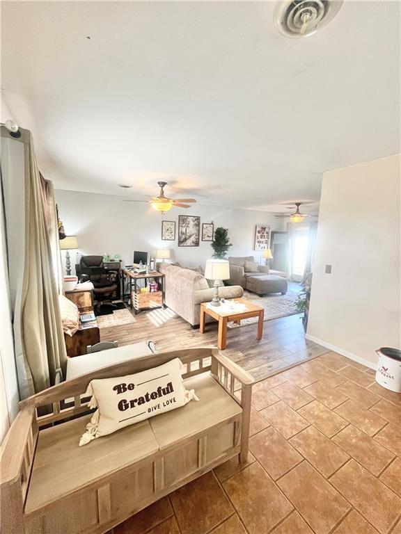 living room featuring ceiling fan