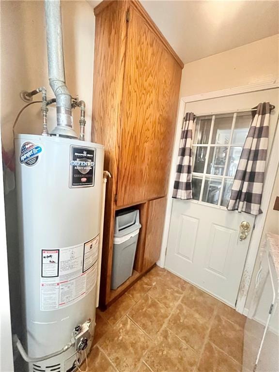 utility room featuring gas water heater