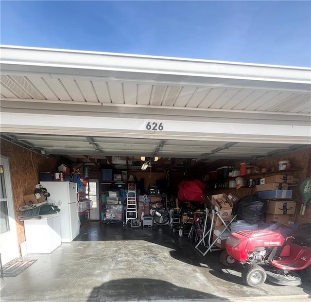 garage with white refrigerator