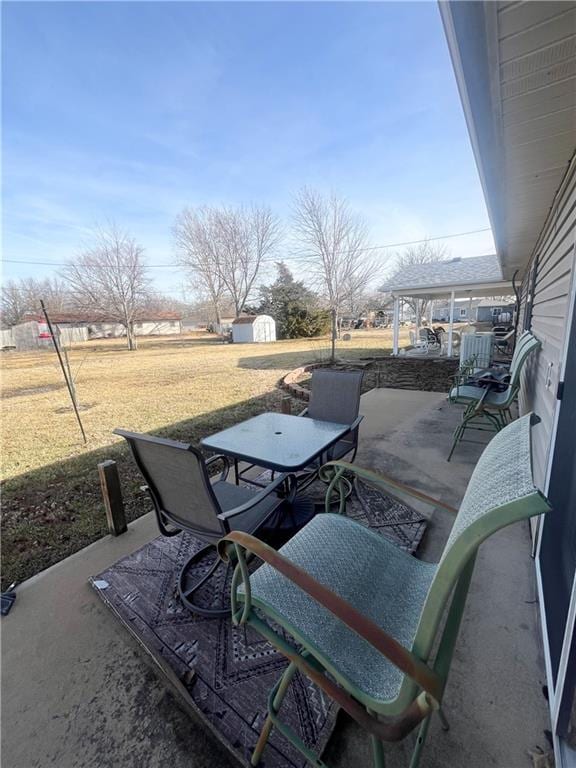 view of patio / terrace with a storage unit