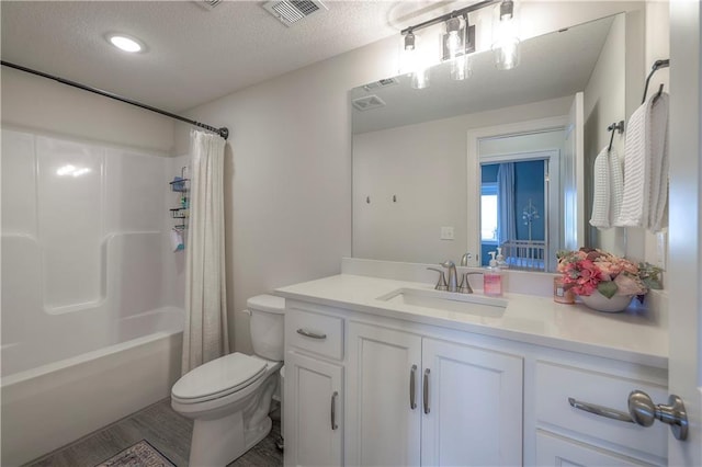 bathroom featuring vanity, shower / bathtub combination with curtain, toilet, a textured ceiling, and visible vents