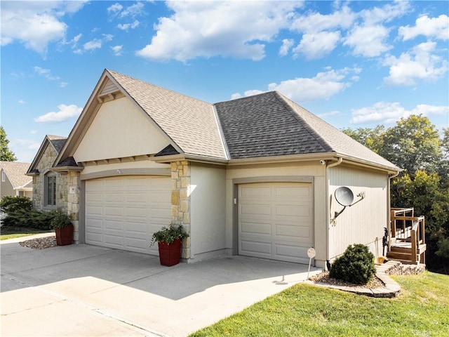 view of front of property featuring a garage, stone siding, a shingled roof, and driveway