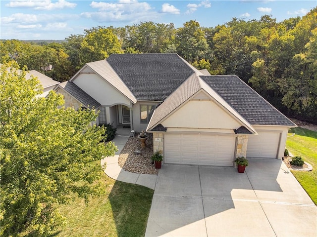 single story home with stone siding, concrete driveway, and roof with shingles