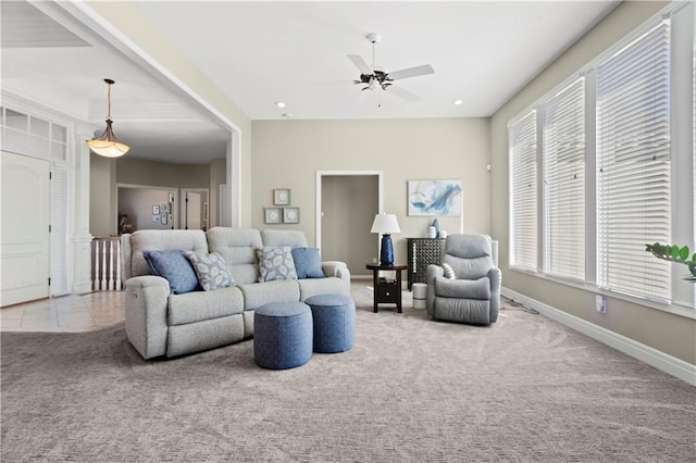 carpeted living area featuring ceiling fan, recessed lighting, tile patterned flooring, and baseboards