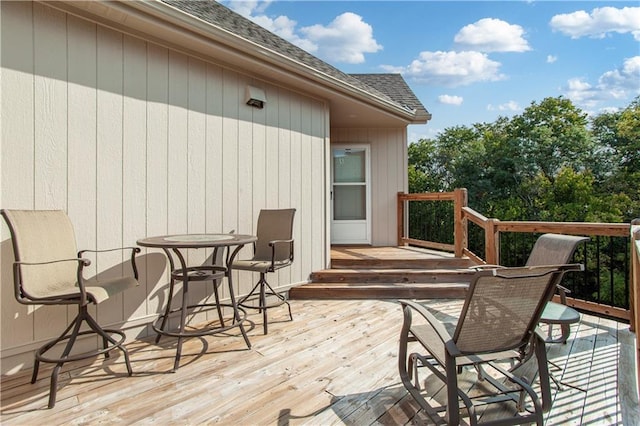 deck with outdoor dining area