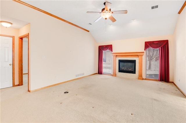 unfurnished living room featuring light carpet, vaulted ceiling, and ceiling fan