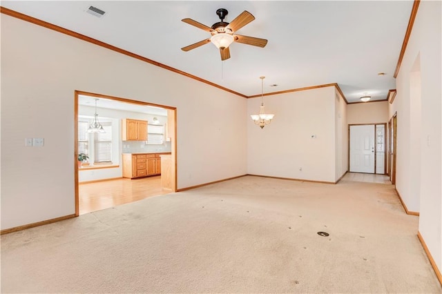 unfurnished living room featuring crown molding, ceiling fan with notable chandelier, and light colored carpet