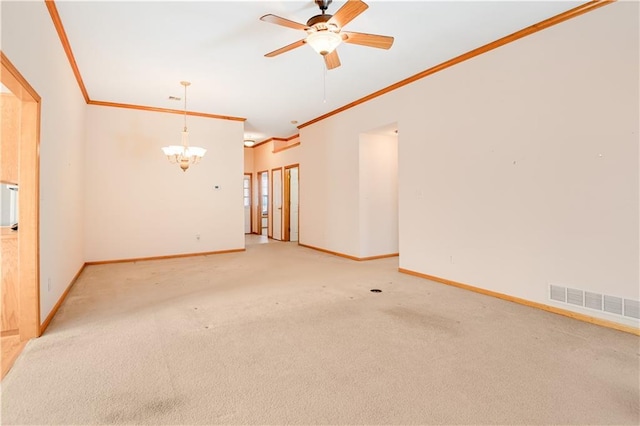 unfurnished room featuring ornamental molding, ceiling fan with notable chandelier, and carpet