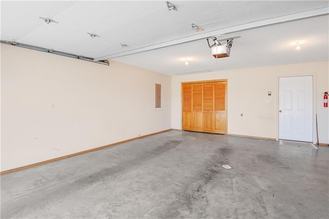 garage featuring a garage door opener and electric panel