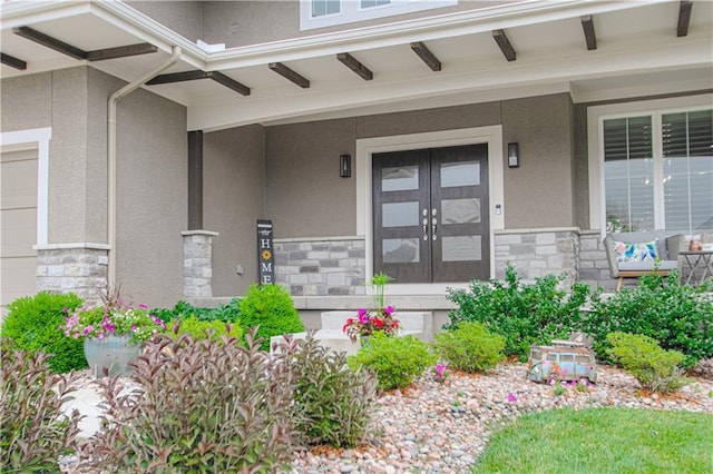 property entrance with french doors and covered porch