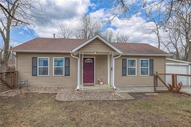 view of front of house with a garage and a front yard