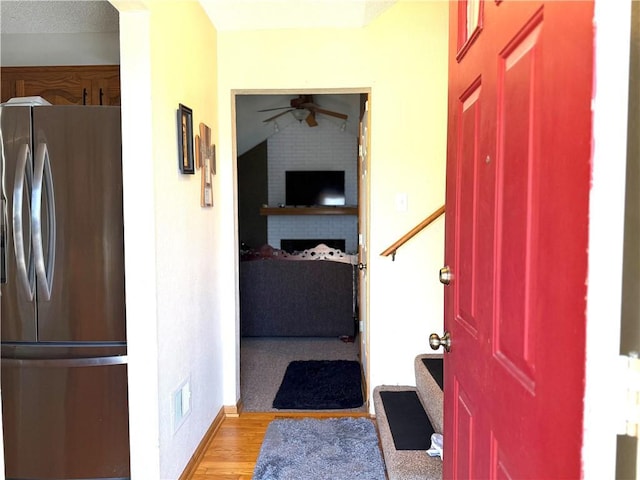 entryway with light hardwood / wood-style flooring and ceiling fan