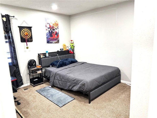 bedroom featuring light carpet