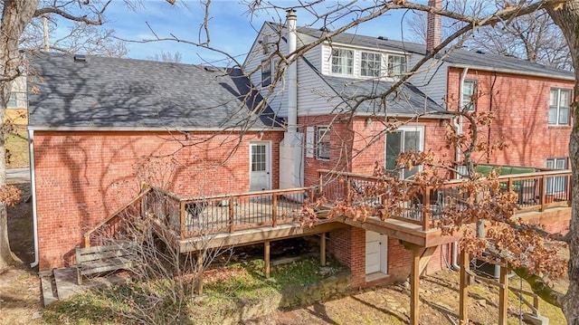 back of property with a wooden deck