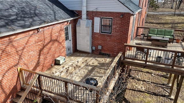 wooden deck featuring outdoor lounge area