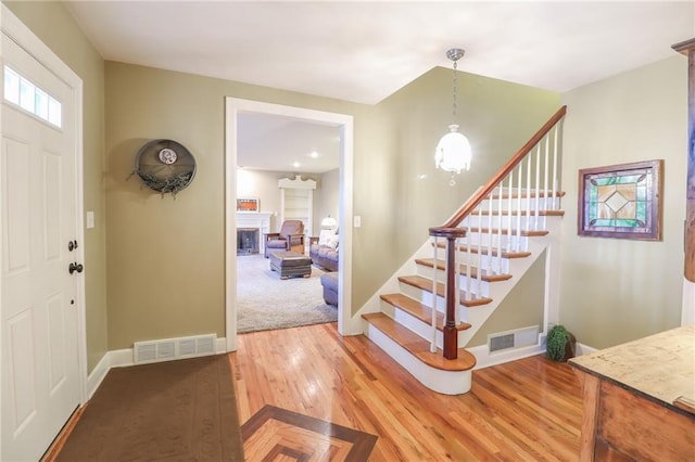 foyer entrance with wood-type flooring