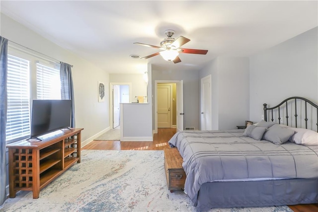 bedroom featuring ceiling fan and light wood-type flooring