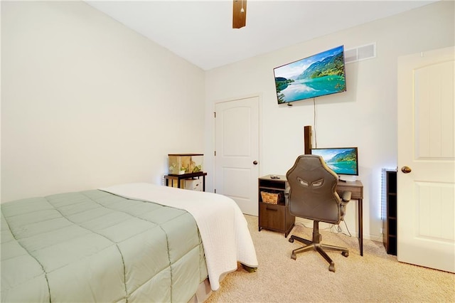 bedroom with light carpet and ceiling fan