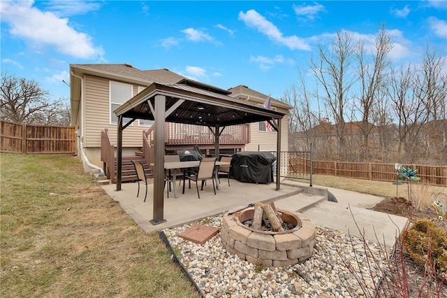 view of patio featuring area for grilling, a gazebo, and a fire pit