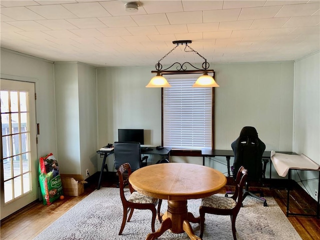 dining space with hardwood / wood-style flooring