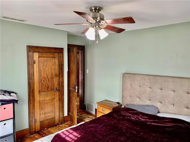 bedroom featuring ceiling fan and hardwood / wood-style floors