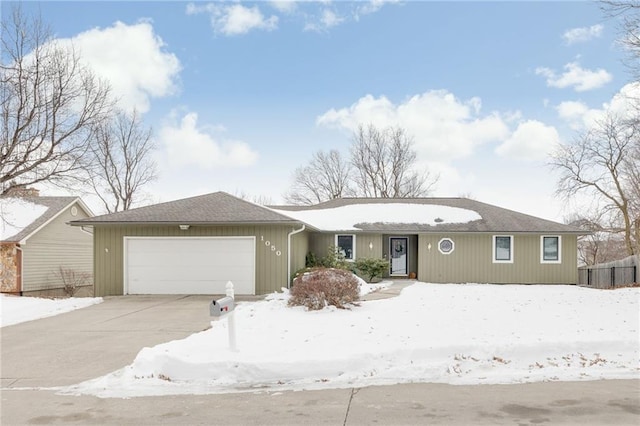 ranch-style home featuring a garage