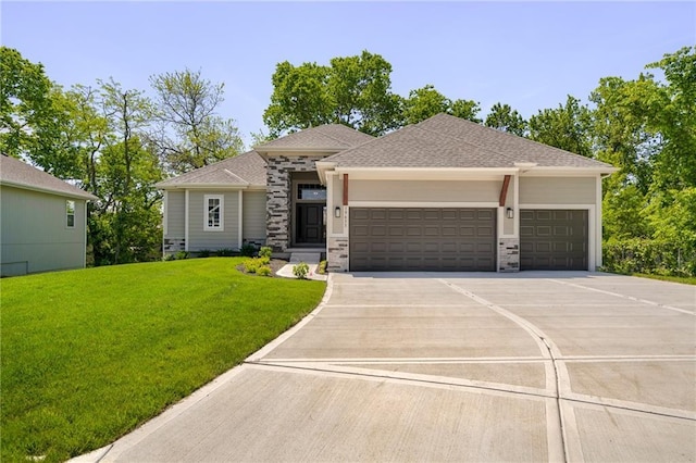 prairie-style house with a garage and a front lawn