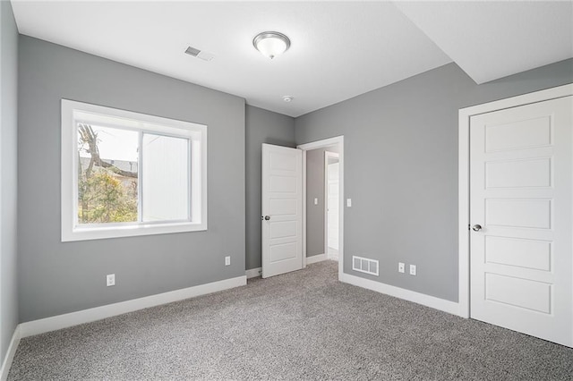 unfurnished bedroom featuring carpet flooring