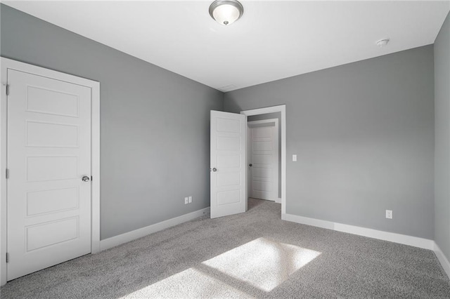 unfurnished bedroom with carpet floors