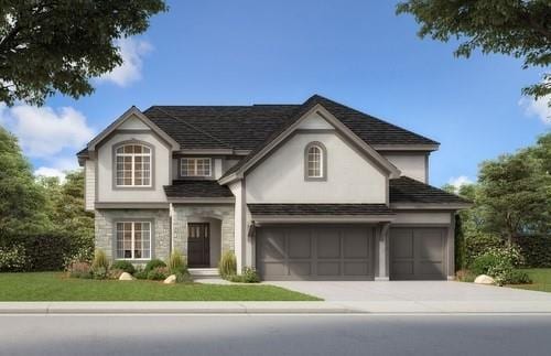 view of front facade with a garage and a front yard